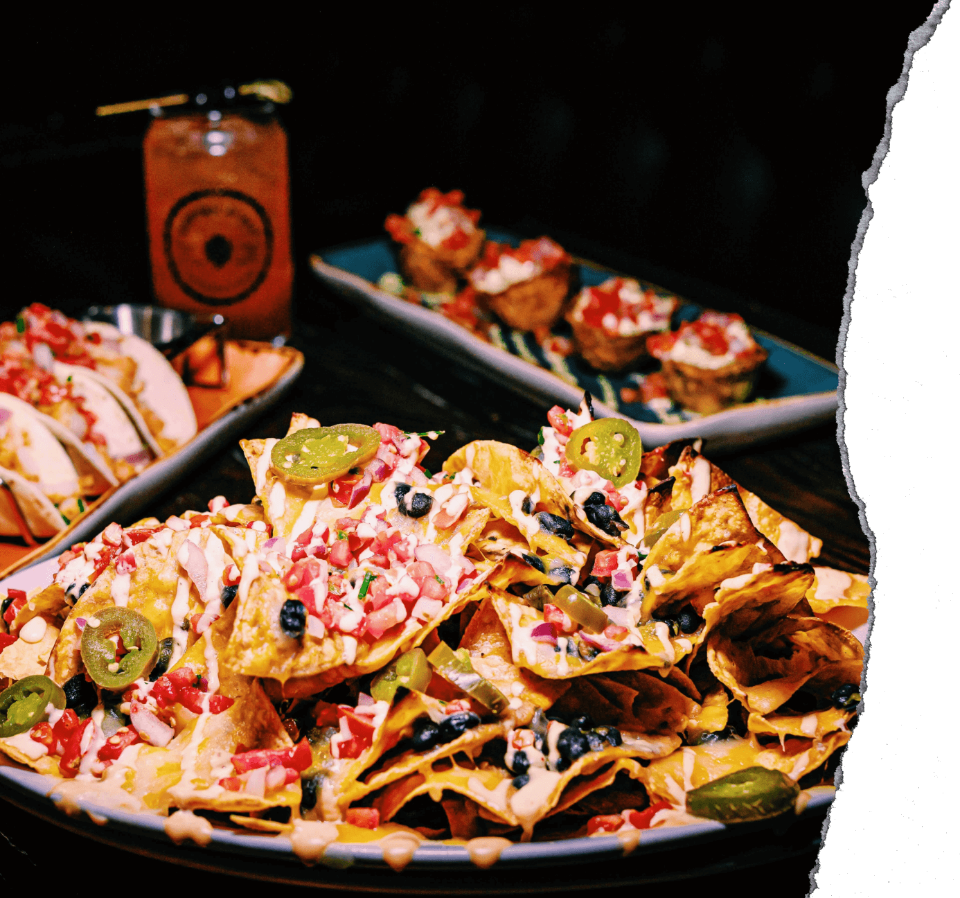 a spread of food and drinks on a wooden table