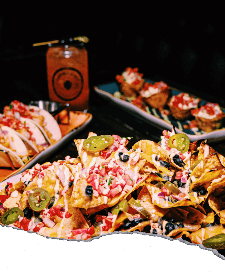 a spread of food and drinks on a wooden table