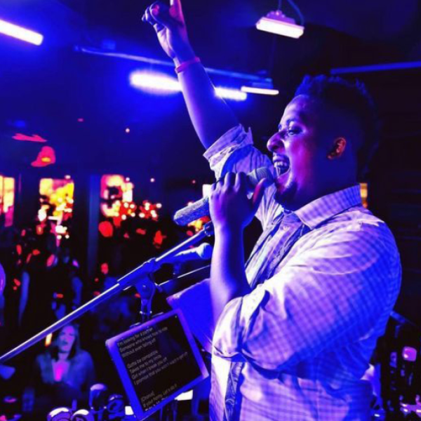 A man singing into a microphone